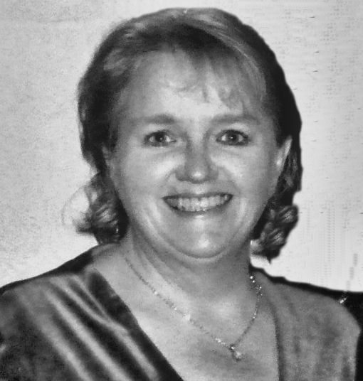 Black and white headshot of a smiling woman